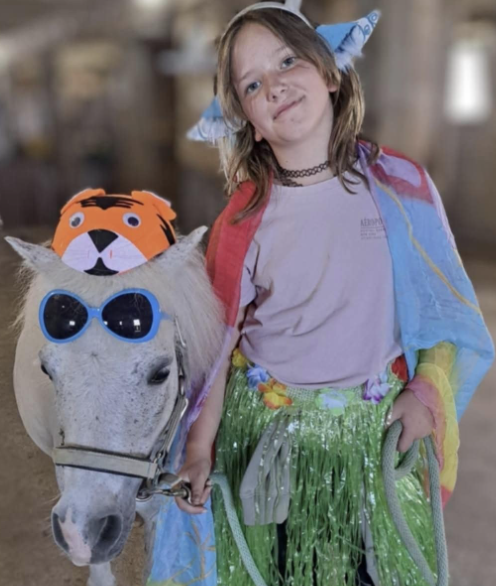 Girl and a pony with sunglasses